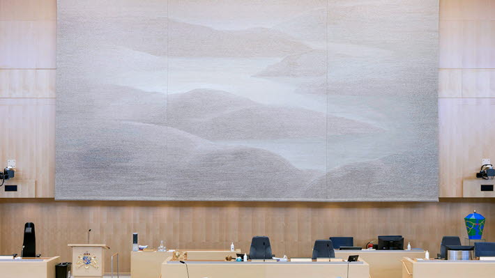 The tapestry Memory of a landscape hangs in the Chamber behind the Speaker's platform.