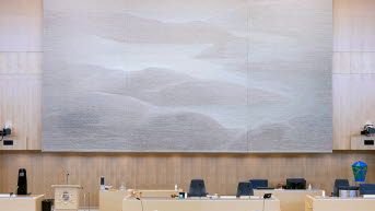 The tapestry Memory of a landscape hangs in the Chamber behind the Speaker's platform.
